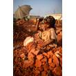girl-working-in-brick-crushing-factory.jpg